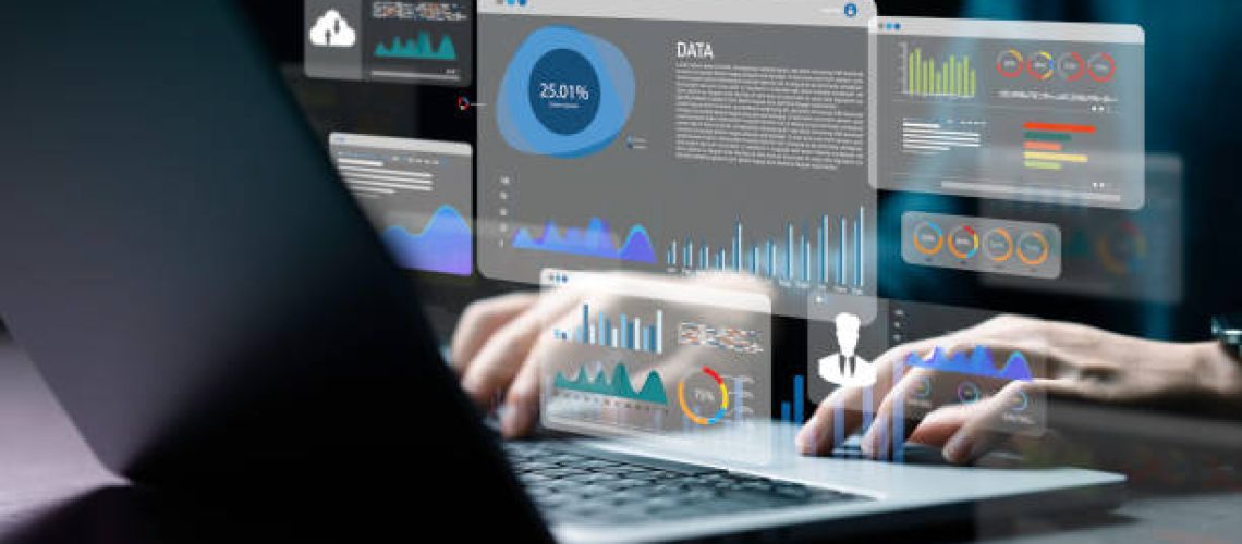 An analyst uses a computer and dashboard for data business analysis and Data Management System with KPI and metrics connected to the database for technology finance; operations; sales; marketing